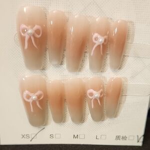 Elegant Nude Press-On Nails with Pink Bow